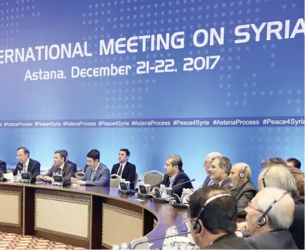  ??  ?? Members of the delegation­s take part in the peace talks on Syria in Astana, Kazakhstan, on Friday. (Reuters)