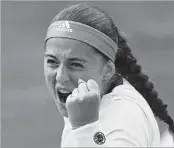  ?? GABRIEL BOUYS/GETTY-AFP ?? Latvia’s Jelena Ostapenko reacts after beating Caroline Wozniacki in the quarterfin­als Tuesday at Roland Garros.