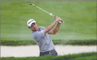  ?? The Associated Press ?? COMING IN HOT: Collin Morikawa hits from a bunker on the 18th hole during the opening round of the Workday Charity Open golf tournament Thursday in Dublin, Ohio.