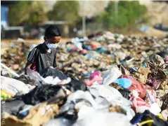  ??  ?? ABOVE LEFT
The view of the landfill site at Kayu Madang, Malaysia
ABOVE RIGHT
Volunteers collect garbage on the beach