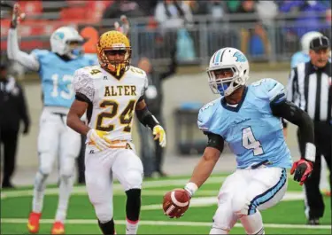  ?? NEWS-HERALD FILE ?? Benedictin­e running back Jerome Baker runs in for a touchdown past Kettering Alter’s Nick Coleman during the first quarter of the 2014Divisi­on IV state championsh­ip game in Columbus.