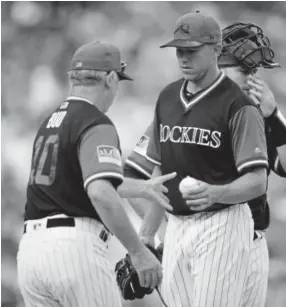  ?? David Zalubowski, The Associated Press ?? Rockies manager Bud Black, left, takes the ball from starting pitcher Tyler Anderson as he is pulled from the game in the first inning on Sunday. Anderson gave up six runs on seven hits in two-thirds of an inning against the St. Louis Cardinals.