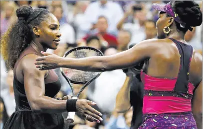  ?? Adam Hunger ?? Serena Williams, left, greets sister Venus after beating her 6-1, 6-2 in the third round of the U.S. Open. The Associated Press