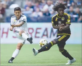  ?? The Canadian Press ?? Vancouver Whitecaps striker Fredy Montero, left, has his shot blocked by Columbus Crew’s Lalas Abubakar during second-half MLS action in Vancouver on Saturday.