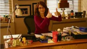  ?? JESSICA MIGLIO/NBC ?? Tina Fey in “30 Rock,” one of the series in which TV scriptwrit­ers have found subject matter in their workplace: the writers room.