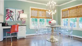  ??  ?? It’s become common for dining spaces to have multiple uses, as in this dining room designed by Abbe Fenimore, which includes space for a desk and chair for use as a home office.