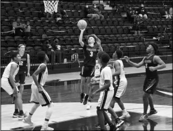  ?? Photo by Alexis Meeks ?? Malvern 9th grade Cub, Tre Richardson (3), shoots the ball during the Cubs and Jr. Trojans’ game on Tuesday.