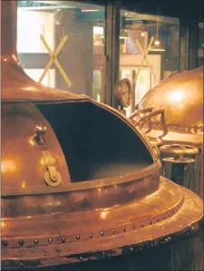  ?? MARTY NACHEL ?? Beer vats are pictured in a Midwestern brewery in the mid-1990s. Orland Park resident Marty Nachel recently self-published his guidebook to the region’s craft beer scene that he originally compiled in 1995.