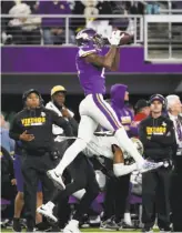  ?? Jeff Roberson / Associated Press ?? Stefon Diggs makes the game-winning catch over New Orleans safety Marcus Williams.