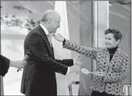  ?? AP/LAURENT CIPRIANI ?? French Foreign Minister Laurent Fabius (left) hands over the symbolic keys to Le Bourget to United Nations climate chief Christiana Figueres on Saturday to officially transfer the community to U.N. control for the 100-nation climate conference that...