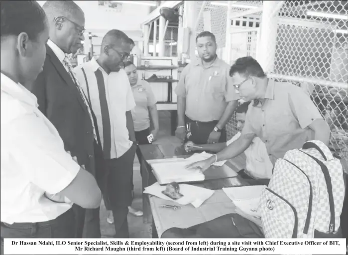  ?? ?? Dr Hassan Ndahi, ILO Senior Specialist, Skills & Employabil­ity (second from left) during a site visit with Chief Executive Officer of BIT, Mr Richard Maughn (third from left) (Board of Industrial Training Guyana photo)