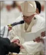  ?? AP PHOTO – GREGORIO BORGIA ?? Pope Francis baptizes John Ogah as he presides over a solemn Easter vigil ceremony in St. Peter’s Basilica at the Vatican, Saturday, March 31, 2018.