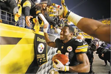  ?? Gene J. Puskar / Associated Press ?? Wide receiver Antonio Brown, who had 212 all-purpose yards, celebrates as he heads to the locker room in the wake of Pittsburgh’s victory. His 63-yard catch-and-run in the fourth quarter sealed the win.