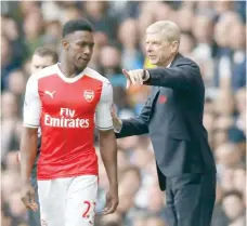  ?? — Reuters ?? Arsenal manager Arsene Wenger speaks with Danny Welbeck before he comes on as a substitute.