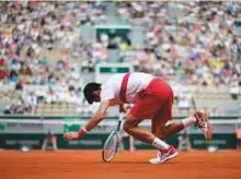  ?? AFP ?? Serbia’s Novak Djokovic stumbles on a point against Spain’s Jaume Munar during a second-round match.