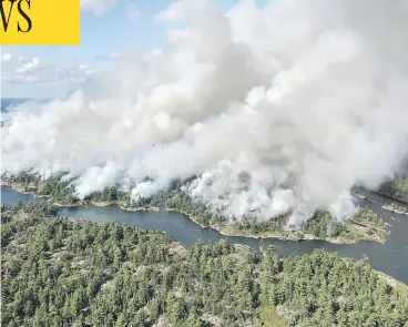  ?? DAN LEONARD/THE CANADIAN PRESS/HO/AFFES IGNITION/RESPONSE SPECIALIST ?? Ontario firefighte­rs have been fighting the blaze known as Parry Sound 33 with the help of counterpar­ts from other provinces, as well as the United States and Mexico. The wildfire has burned more than 100 square kilometres.