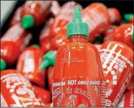  ?? AP file photo/NICK UT ?? Merriam-Webster finally decided Sriracha is hot enough to add to its dictionary.