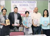  ??  ?? From left: KZN Department of Education circuit manager Lindiwe Myende, POST editor Krisendra Bisetty, school prinicpal Kamaladevi Govender, SGB vice-chairperso­n Musa Mbokozi and SGB chairperso­n Marlene Ramash.