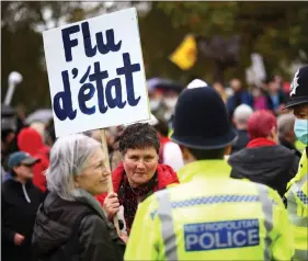  ?? REUTERS ?? Anti-lockdown protesters take part in a march, amid Covid-19 outbreak, in London, Britain on Saturday.
