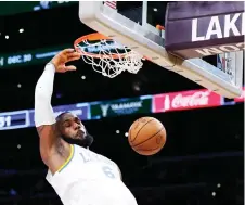  ?? — AFP file photo ?? James dunks during a 122-118 loss to the Boston Celtics at Crypto.com Arena in Los Angeles, California.