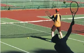  ?? J ?? Top: Michael Fujimoto, 73, has been a regular at the Golden Gate Park Tennis Center for more than 50 years. Above: Darryl Fong serves while Bob Hall gets ready.