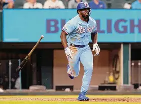  ?? LM Otero / Associated Press ?? Adolis Garcia, running after his two-run triple in the third inning, enjoyed a three-hit outing with four RBIS batted in Sunday afternoon for the Rangers.