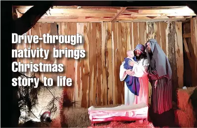  ?? Staff photo by Junius Stone ?? ■ Actors portray Joseph, Mary and baby Jesus on Friday night at First Assembly of God’s annual drive-through nativity on West Seventh Street in Texarkana, Texas. The event continues on Saturday and Sunday nights.