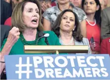  ?? AP ?? House Minority Leader Nancy Pelosi of California accompanie­d by members of the House and Senate Democrats, gestures during a news conference on Capitol Hill in Washington, Wednesday, September 6, 2017. Senator Kamala Harris is at right.