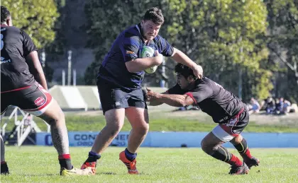  ?? PHOTO: PHIL JANSSEN ?? Club action . . . Excelsior’s William Sutherland breaks through the Old Boys defence in a Citizens Shield match played in Oamaru earlier this season.