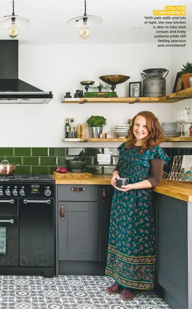  ??  ?? COLOUR CONFIDENCE ‘With pale walls and lots of light, the new kitchen is able to take dark colours and lively patterns while still feeling spacious and uncluttere­d’