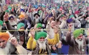  ?? PHOTO: PTI ?? Farmers stage a protest against the three farm laws at Tikri border, in New Delhi, on Thursday