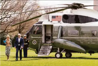  ?? Andrew Harnik / Associated Press ?? President Biden and first lady Jill Biden arrive at the White House in March. Most of the money the Bidens earned came from his $400,000 annual salary for being president and two pensions.