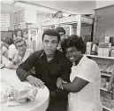  ?? Charles Trainor 1972 ?? Muhammad Ali (left) with a fan in 1971. He is the subject of a new eighthour documentar­y series on PBS.