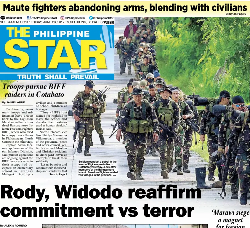  ?? EPA ?? Soldiers conduct a patrol in the town of Pigkawayan in North Cotabato yesterday, a day after members of the Bangsamoro Islamic Freedom Fighters raided two villages in the province.