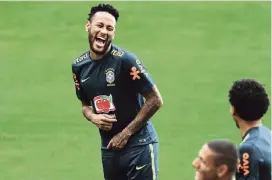  ?? DAVID SANTIAGO dsantiago@miamiheral­d.com ?? Brazil’s superstar forward Neymar, laughing with teammates during practice Thursday, will play for the first time in three months since spraining an ankle.