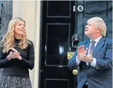  ??  ?? Carrie Symonds and Boris Johnson clap for carers outside No 10