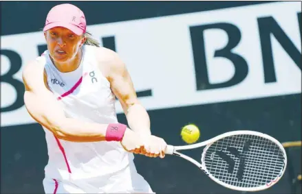  ?? (AP) ?? Iga Swiatek, of Poland, returns the ball to Yulia Putintseva, of Kazakhstan, during their match at the Italian Open tennis tournament in Rome.