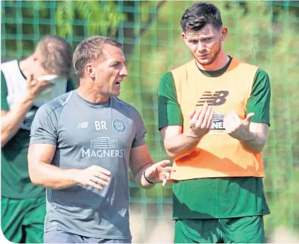  ??  ?? Oliver Burke has a discussion with manager Brendan Rodgers during Celtic’s winter training camp in Dubai