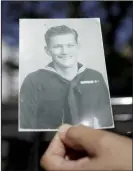  ?? (NWA Democrat-Gazette/Charlie Kaijo) ?? Old photos of King show a dashing young serviceman who joined the Coast Guard when he was just 16.