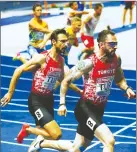  ??  ?? Yiğitcan Hekimoğlu (left) hands over to Ramil Guliyev on their way to take second place in the men’s 4x100m Relay final at the Athletics 2018 European Championsh­ips, in Berlin, Germany on Sunday