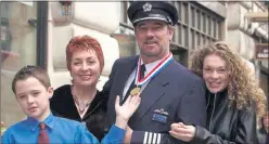  ??  ?? MEDAL: William Hagan with Charmaine, daughter Alanna and son Aiden and his award.