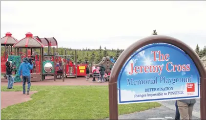  ?? ANDREW WATERMAN/SPECIAL TO THE TELEGRAM ?? Just moments after the sign’s unveiling, the students of St. Andrew’s flooded the playground. Eli Cross said the quote on the sign is fitting for his son, who never let cerebral palsy hold him back.