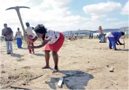  ?? PICTURE: AYANDA NDAMANE ?? STAKING A CLAIM: Nonceba Madolo was one of the Dunoon backyarder­s who invaded vacant land along the N7.