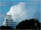  ?? STAFF PHOTO BY DOUG STRICKLAND ?? Clouds billow from the Wacker plant after an explosion released hydrogen chemical gas Sept. 7 in Charleston, Tenn.