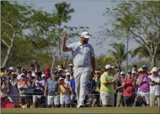  ?? EDUARDO VERDUGO — THE ASSOCIATED PRESS ?? Jon Rahm, of Spain, waves to spectators on the 18th hole after finishing the third round of the Mexico Open on Saturday in Puerto Vallarta, Mexico.