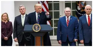  ??  ?? Standing firm: Trump speaking during a news conference in the Rose Garden of the White House.