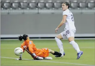  ?? MARK VAN MANEN/ PNG STAF ?? Abby Wambach of the United States scores her first goal of the game against Guatemala in women’s CONCACAF Olympic qualifying soccer action at BC Place on Sunday. The unbeaten U. S. won 13- 0.