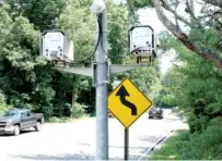  ?? STAFF PHOTO BY TIM BARBER ?? Traffic enforcemen­t cameras are seen in the 3000 block of Hixson Pike on Monday. Although these cameras remain in use under state law, red-light cameras may be banned outright after the 2020 legislativ­e session.