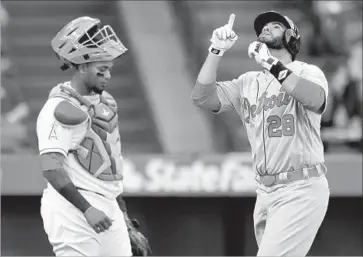  ?? Mark J. Terrill Associated Press ?? THE TIGERS’ J.D. Martinez celebrates his second-inning two-run home run. After Mike Trout homered to tie the score 3-3 Martinez struck again with a solo shot in the top of the ninth to give Detroit the victory.