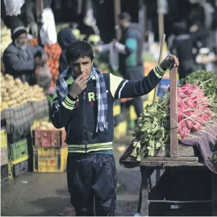  ??  ?? Vegetables on sale at a Gaza city market. The economic crisis there is growing worse